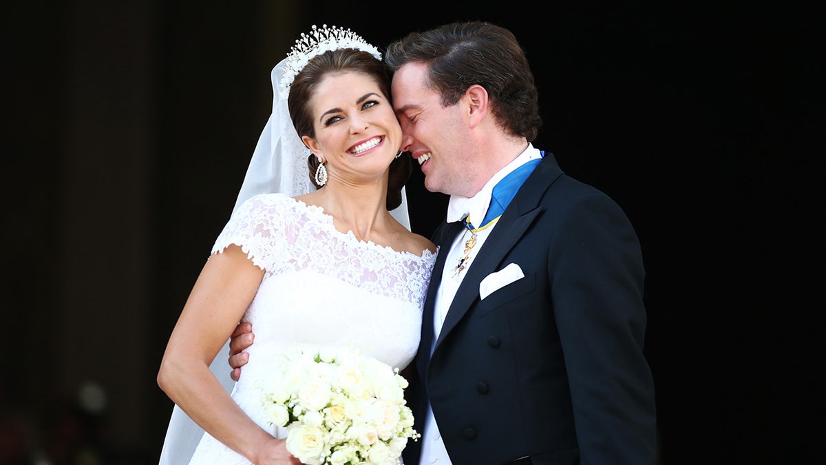 Princess Madeleine of Sweden on her wedding day looking happy with her new husband.