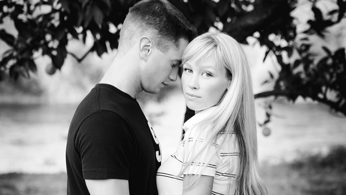 A black and white photo of Sherri Papini looking away from Keith Papini