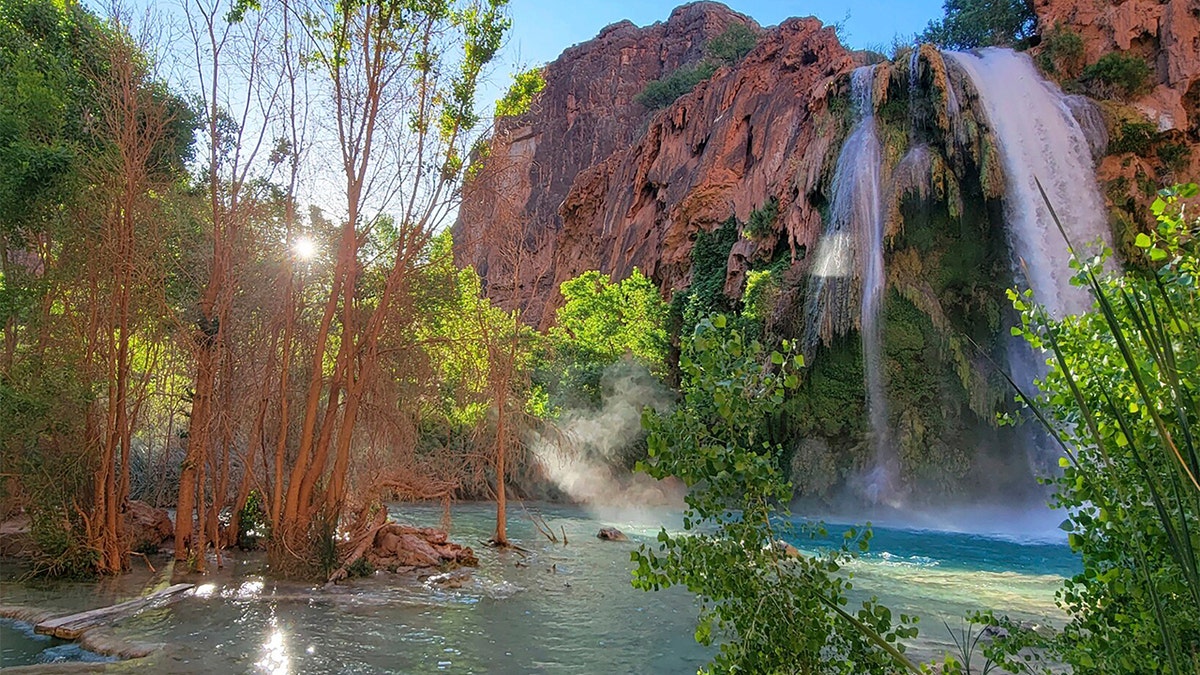 This photo provided by Randy Shannon shows Mooney Falls on the Havasupai reservation outside the village of Supai, Arizona, on May 19. Dozens of tourists say they fell ill on a recent visit to a popular and picturesque stretch of waterfalls deep in a gorge neighboring Grand Canyon National Park.