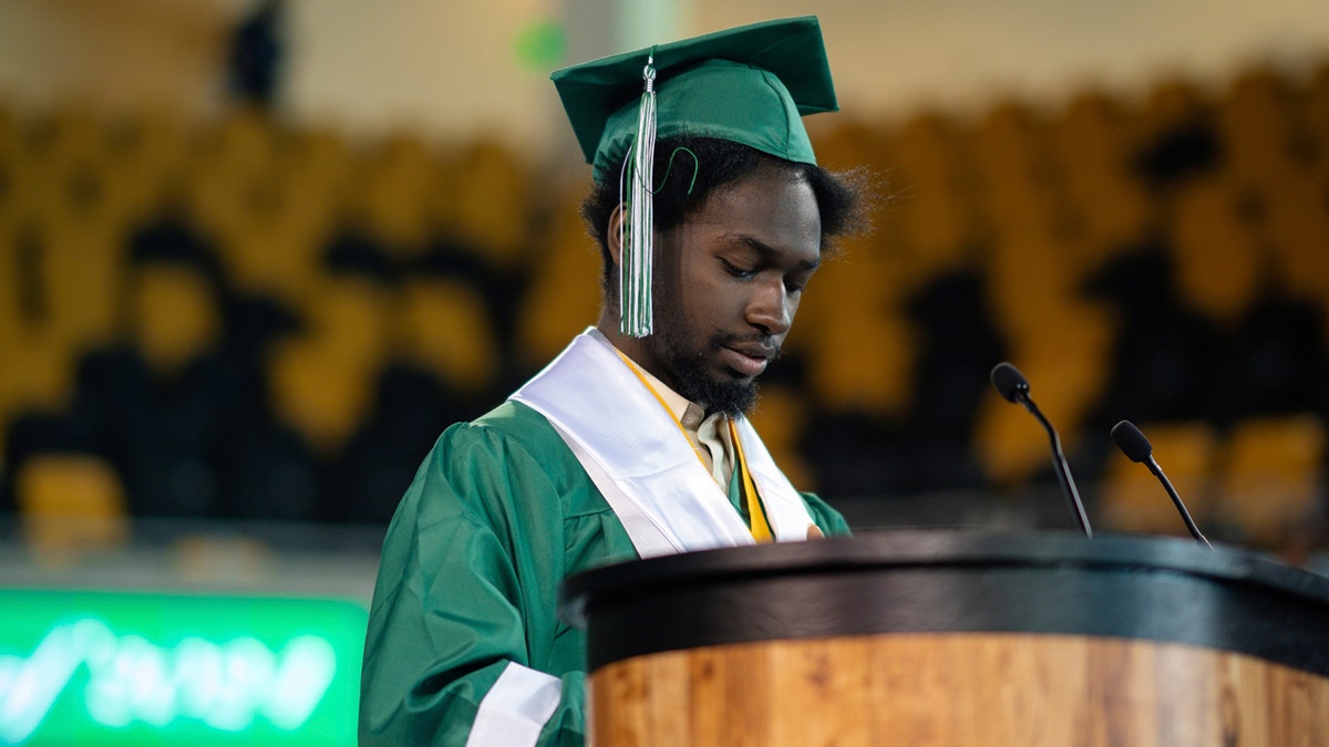 Elijah Hogan speaks during his graduation ceremony at Walter L. Cohen charter high school in New Orleans.