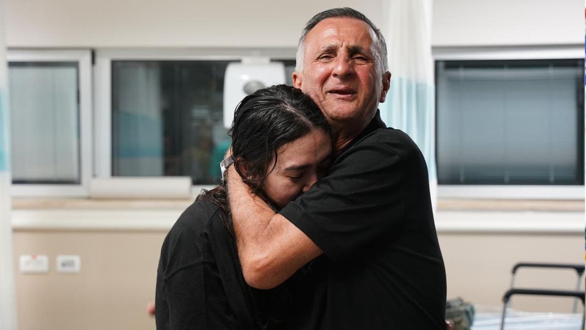 Israeli hostage Noa Argamani hugging her father,