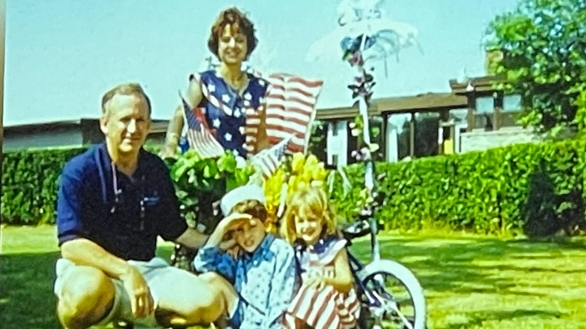 The Ramsey family photographed with American flags