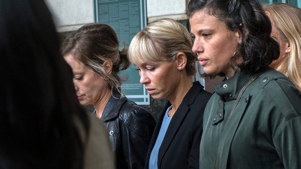 Sherri Papini walked between the two women outside the courthouse.