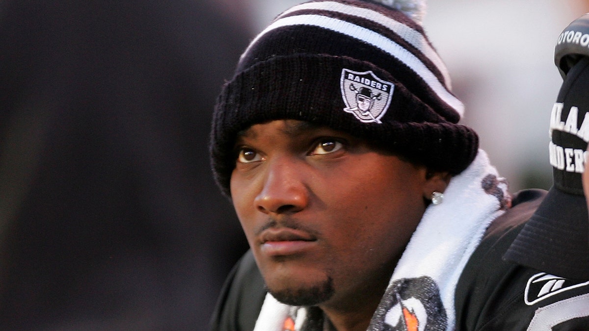 JaMarcus Russell looks on during an NFL game