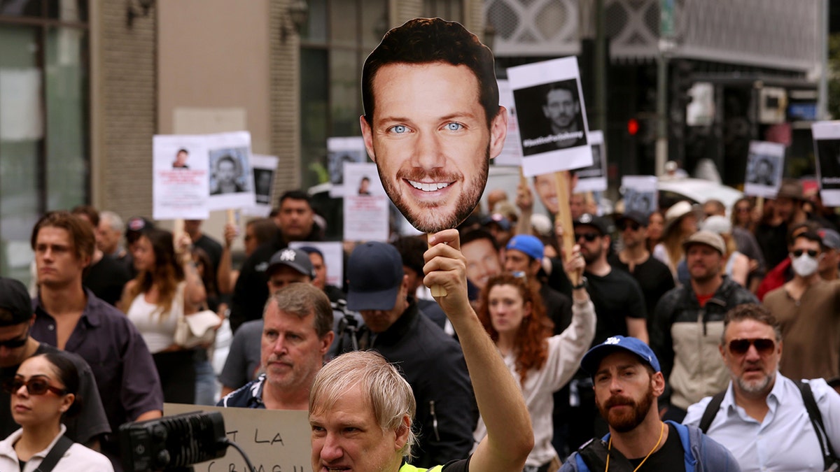 Supporters of the JustiveforJohnny Movement march in downtown Los Angeles