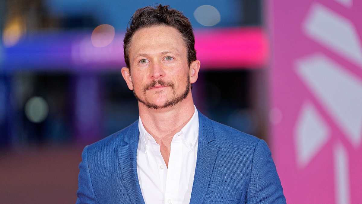 Jonathan Tucker poses for a photo