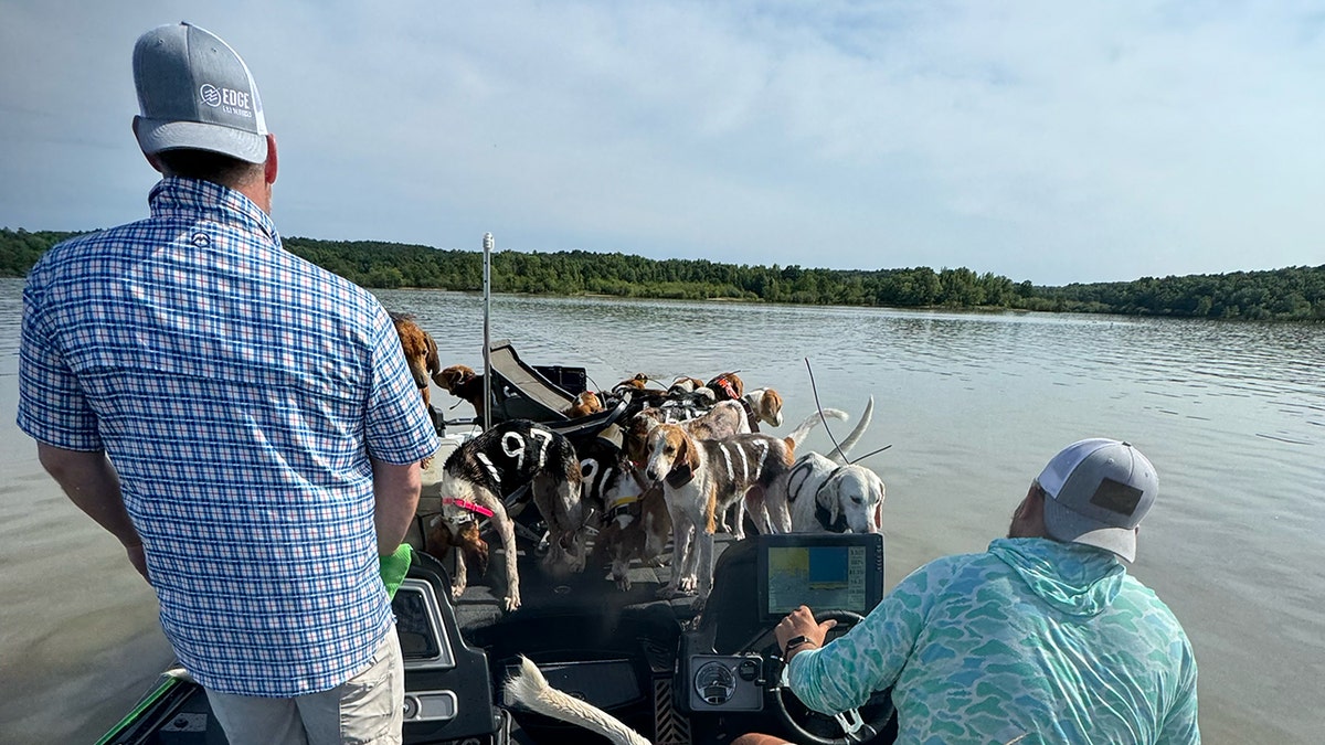 Jordan-and-Brad-on-boat-with-dogs