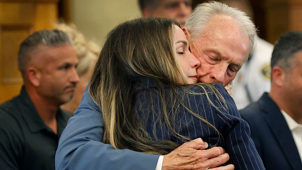 Karen Read gets a long hug from her dad William before the jury breaks for lunch