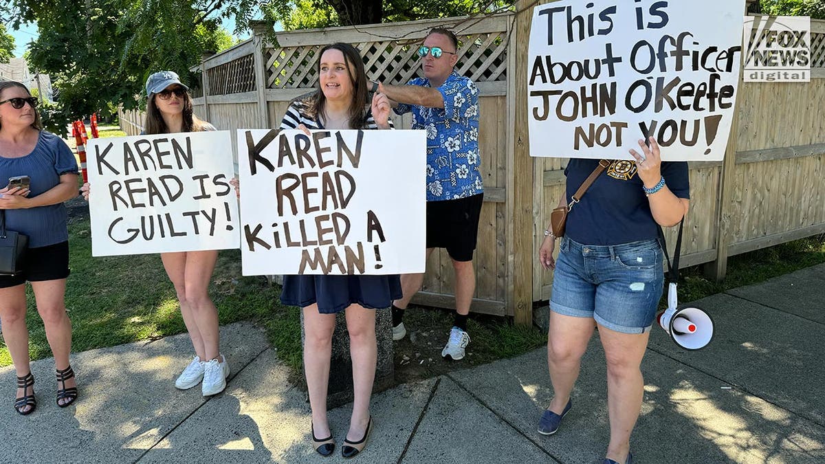 Critics of Karen Read with signs