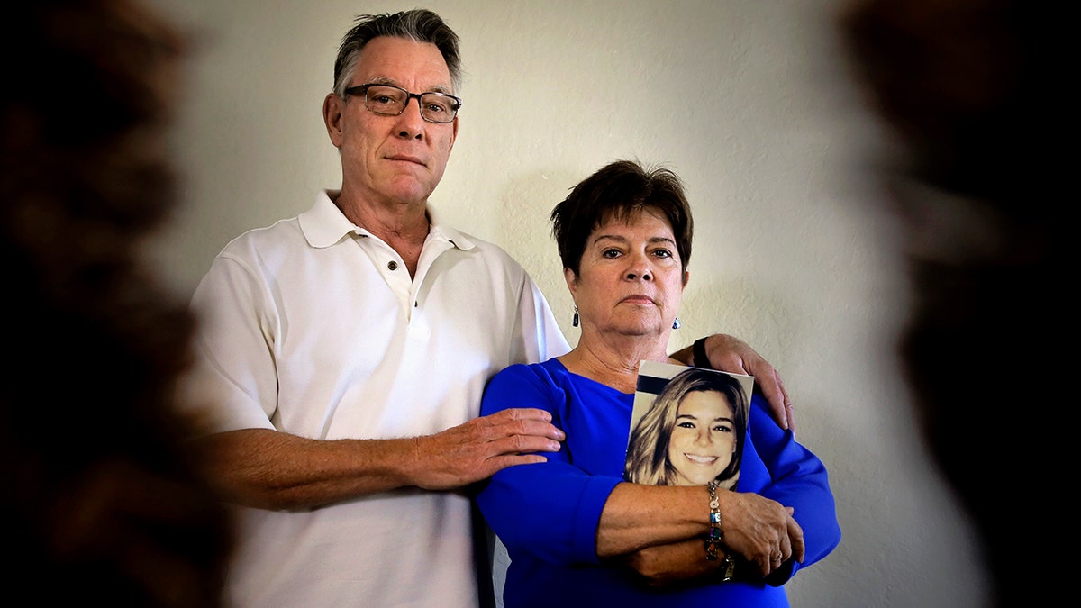 Kate Steinle family, mother holding photo of Kate
