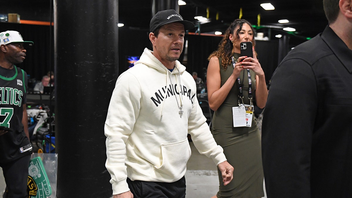 Mark Wahlberg wearing a Municipal sweatshirt 