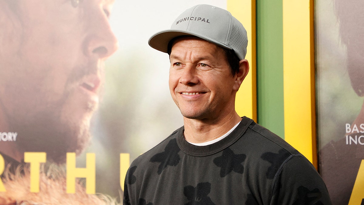 Close up of Mark Wahlberg smiling on the red carpet