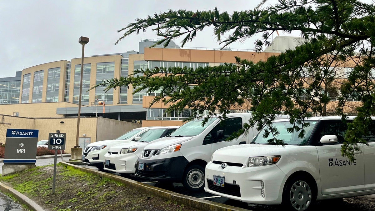White cars parked in the parking lot outside Asante Logue Regional Medical Center in Medford, Oregon.