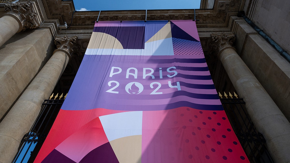Paris Olympics flag on monument