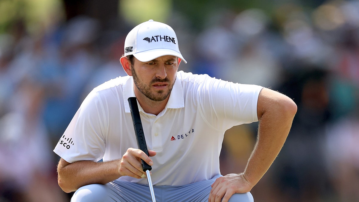 Patrick Cantlay reads the putt