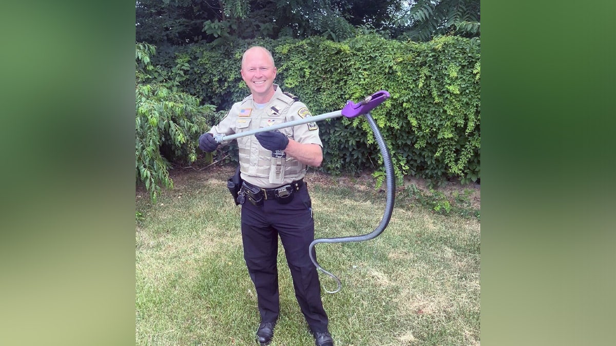 Animal Control Capt. J.A. Bice with snake