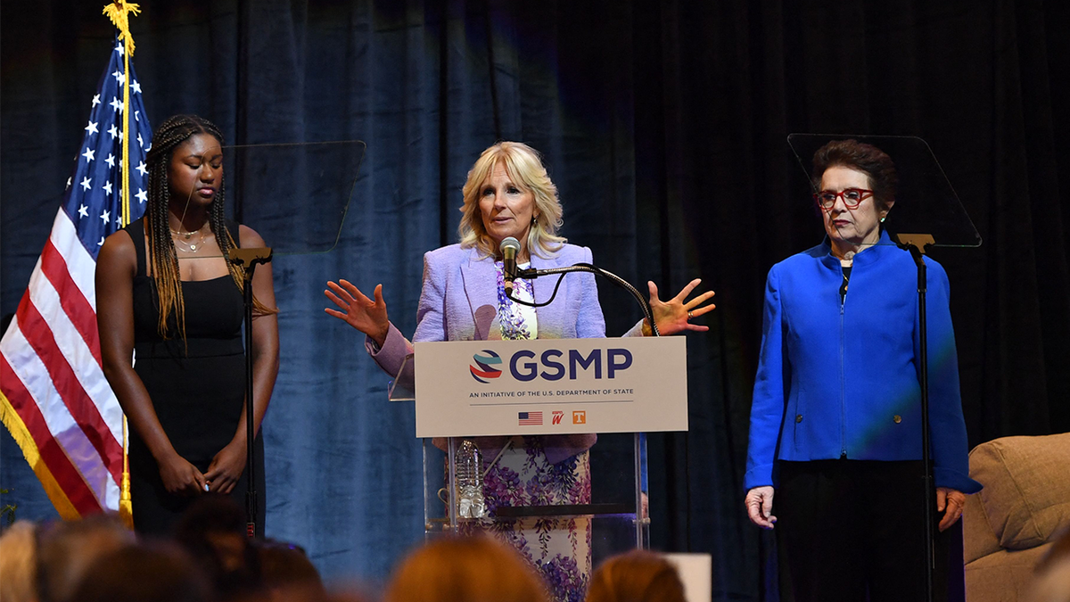 Tennis legend Billie Jean King (R) and high school track athlete Maya Mosley (L) listen to US First Lady Jill Biden speak during an event to mark the 50th anniversary of Title IX at Capitol One Arena in Washington, DC, on June 22, 2022.