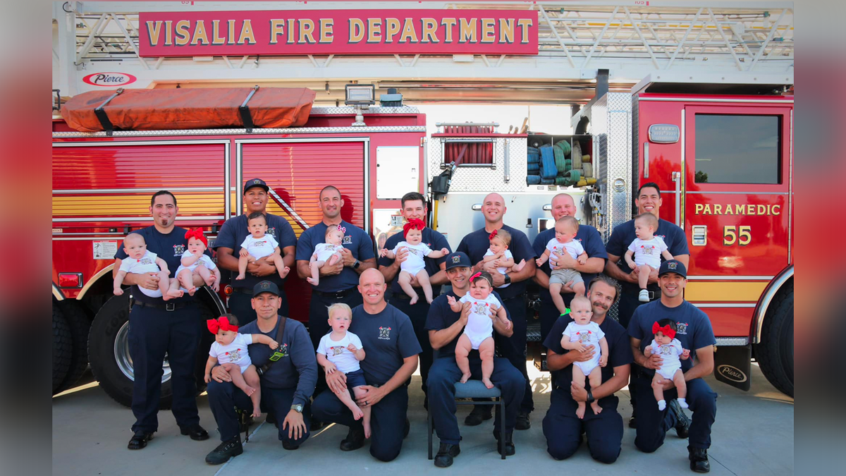 Visalia Fire personnel pose with babies
