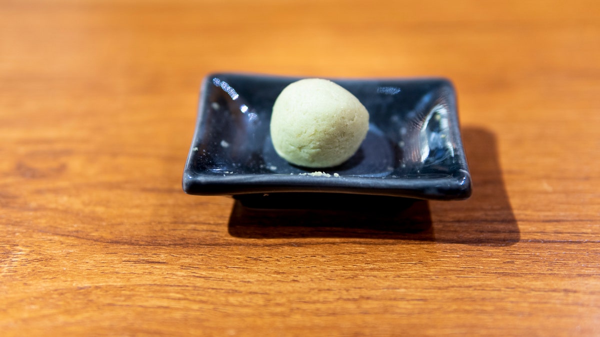 A dish of wasabi is shown at a Japanese restaurant.