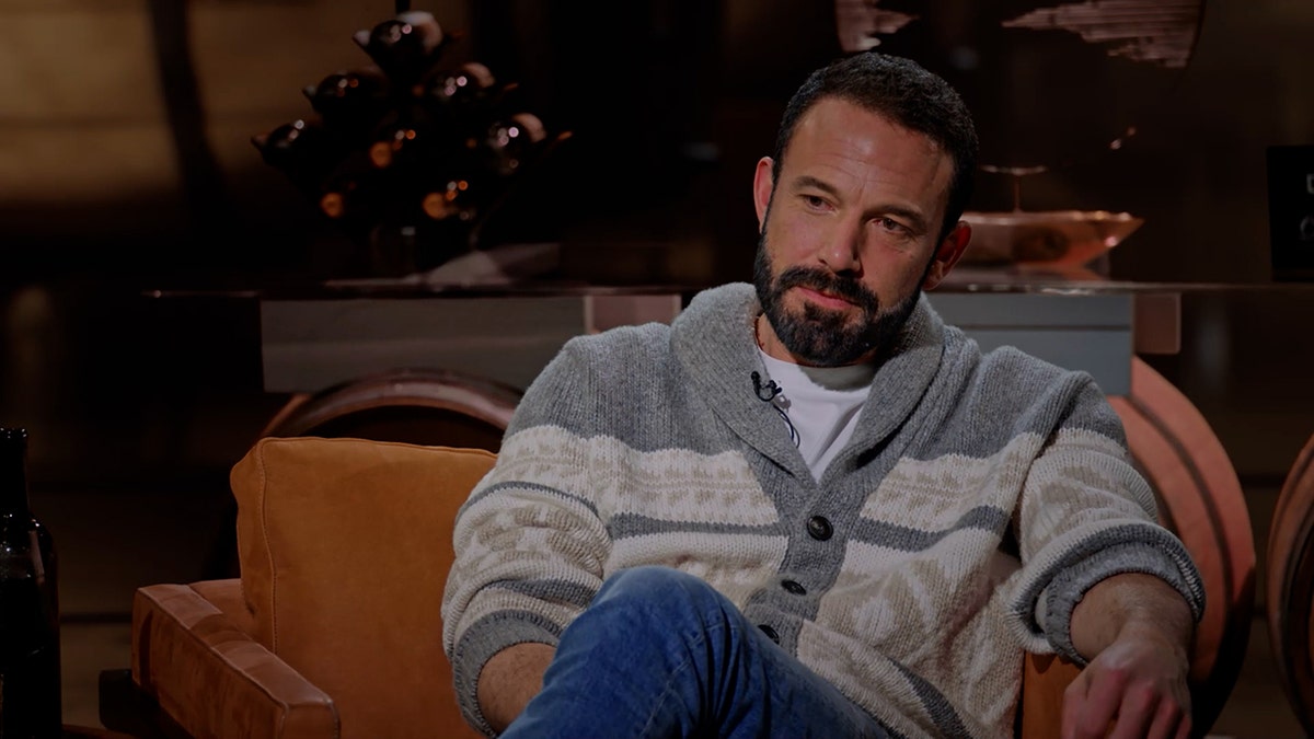 Ben Affleck wears a heavy sweater and jeans.