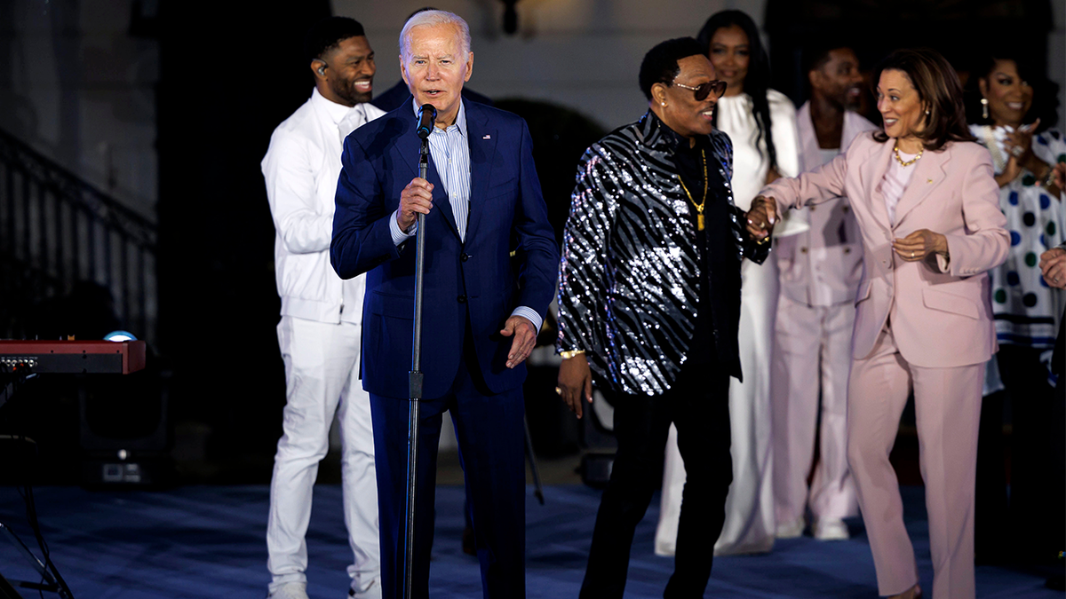 US President Joe Biden, second left, during a Juneteenth concert on the South Lawn of the White House in Washington, DC, US, on Monday, June 10, 2024. In 2021, Biden signed legislation establishing Juneteenth as the nation's newest Federal holiday. Photographer: Ting Shen/Bloomberg via Getty Images