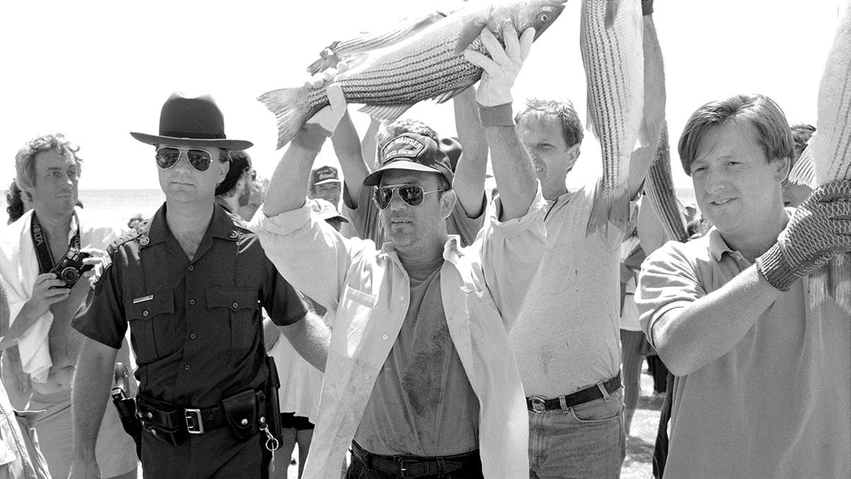 Billy Joel with fishermen during an arrest