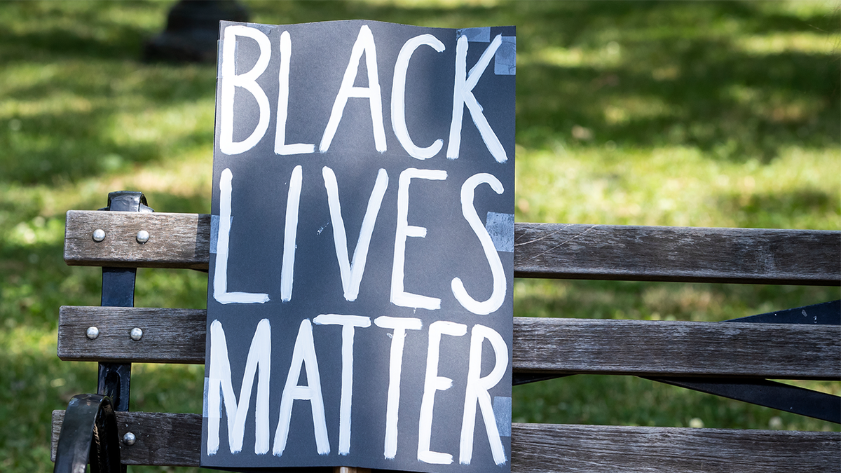 MANHATTAN, NY - JUNE 19: A protesters homemade sign that reads, "Black Lives Matter' sits on a park bench next to a hat in Cadman Plaza in Brooklyn. This was part of the Unite NY 2020, Bringing all of New York Together rally and march as protests that happened around the country to celebrate Juneteenth day which marks the end of slavery in the United States. Protesters continue taking to the streets across America and around the world after the killing of George Floyd at the hands of a white police officer Derek Chauvin that was kneeling on his neck during for eight minutes, was caught on video and went viral. During his arrest as Floyd pleaded, "I Can't Breathe". The protest are attempting to give a voice to the need for human rights for African American's and to stop police brutality against people of color. They are also protesting deep-seated racism in America. Many people were wearing masks and observing social distancing due to the coronavirus pandemic. Photographed in the Manhattan Borough of New York on June 19, 2020, USA. (Photo by Ira L. Black/Corbis via Getty Images)