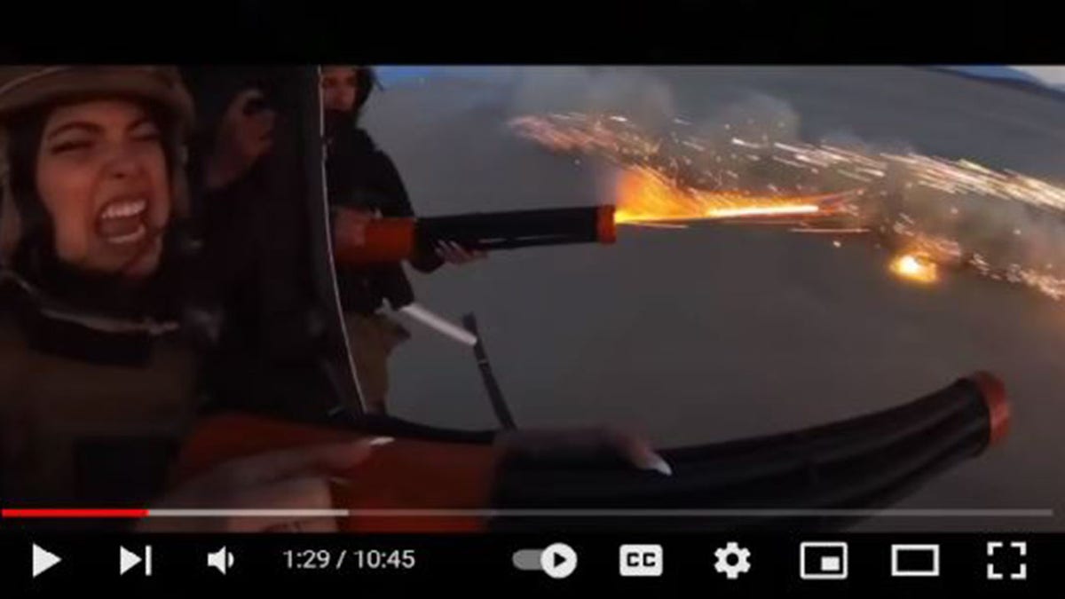 Women shooting fireworks from a helicopter