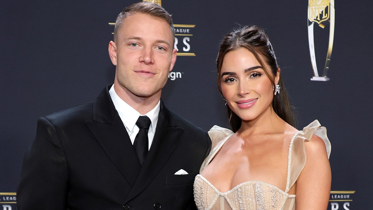 Christian McCaffrey and Olivai Culpo attend the NFL Honors