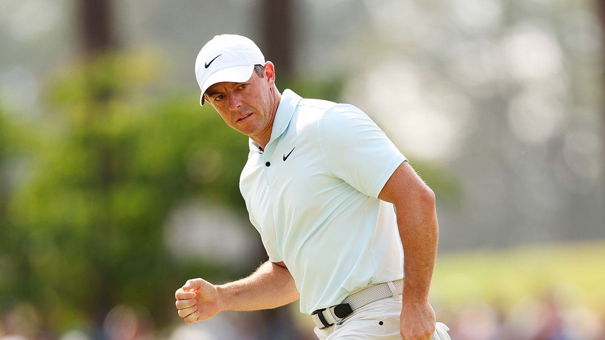 Rory McIlroy looks at putt