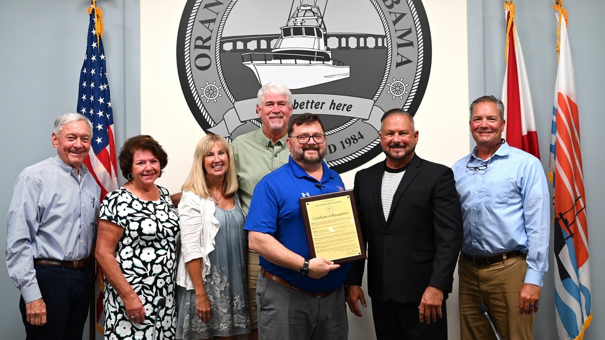 Dr. Ryan Forbess was honored by his hometown or Orange Beach, Alabama, for his "heroic" actions saving a teenager who was bitten by a shark while he was vacationing in Florida.