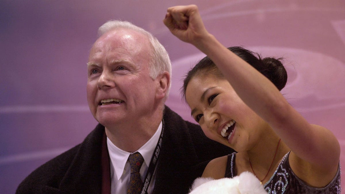 Michelle Kwan and Frank Carroll celebrate