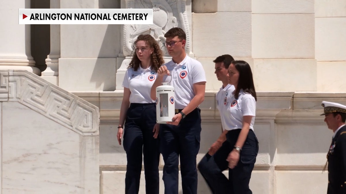 French ambassadors presenting flame from France