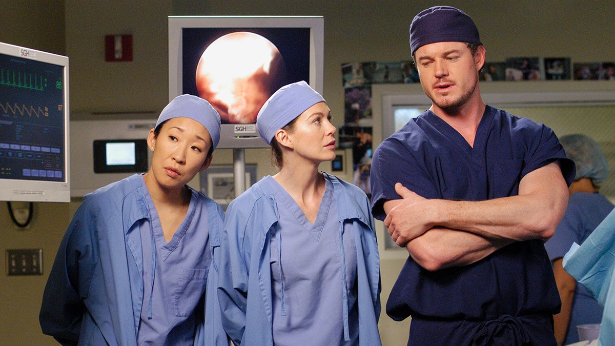 Eric Dane, Ellen Pompeo and Sandra Oh in scrubs on the set of "Grey's Anatomy"