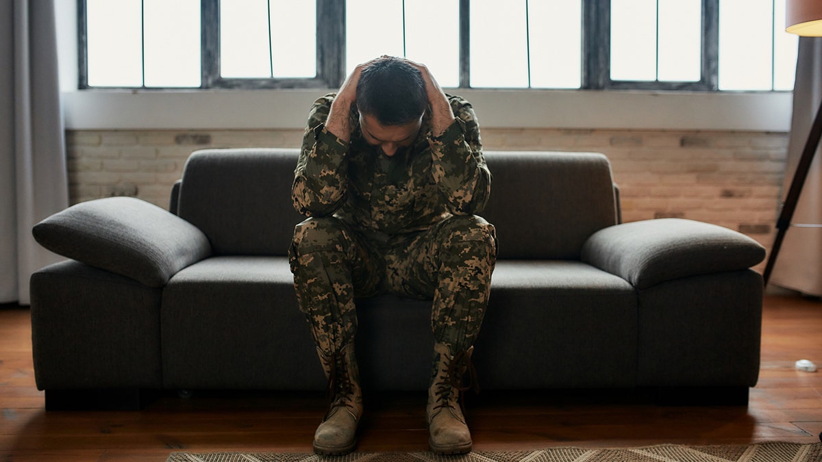 veteran experiencing ptsd on a couch