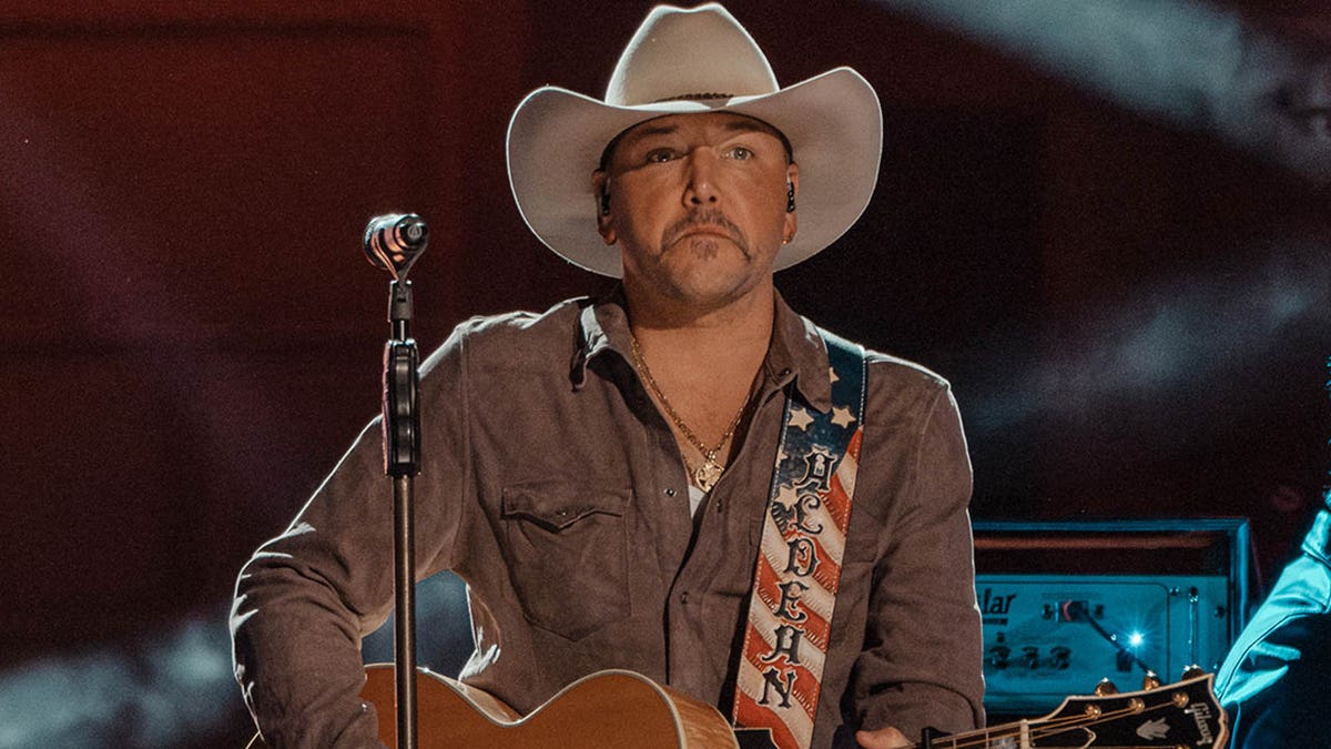 jason aldean performing with american flag guitar strp
