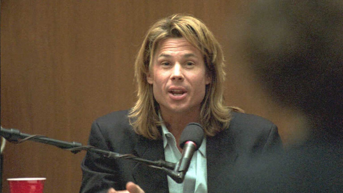 Kato Kaelin sitting on witness stand during O.J. Simpson murder trial.