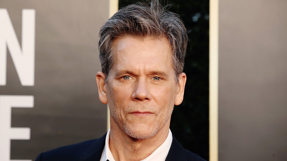 Actor Kevin bacon wears black suit to awards show in Hollywood
