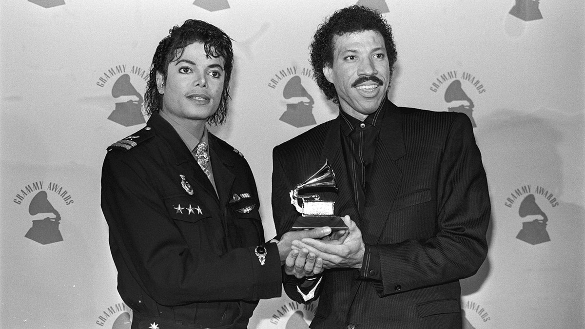 Lionel Richie and Michael Jackson pose with Grammy awards