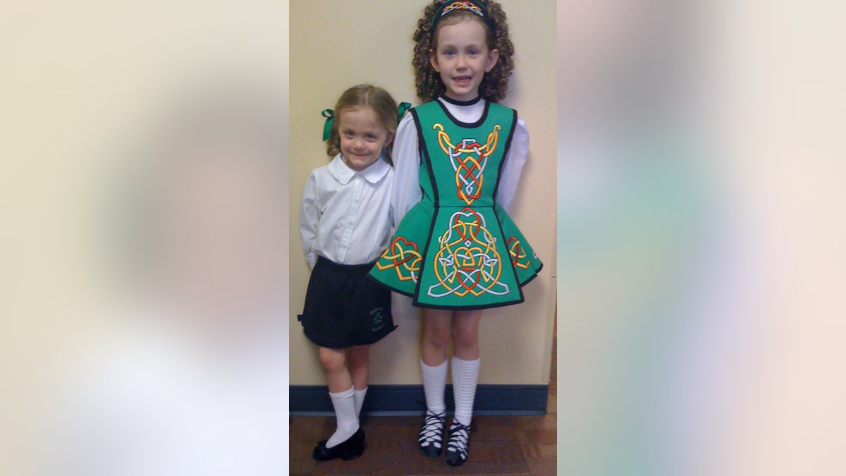 two little girls in Irish dancing outfits