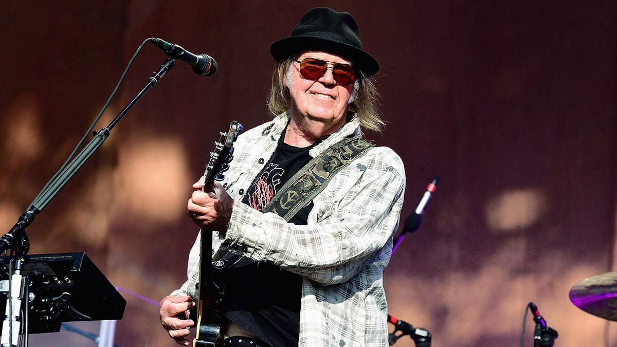 Neil young performs on stage