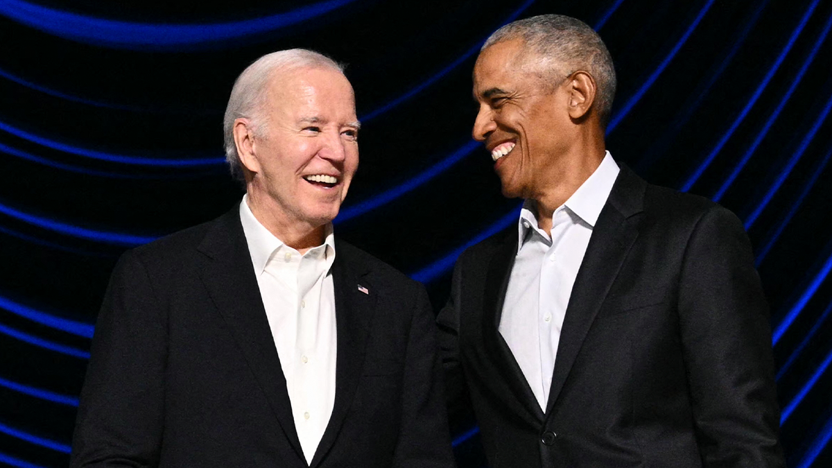 Obama smiles with Biden