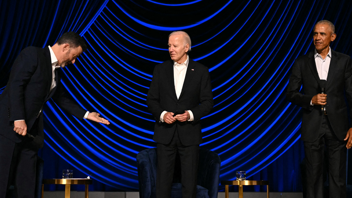 Biden looks to his right at Jimmy Kimmel as Barack Obama looks on