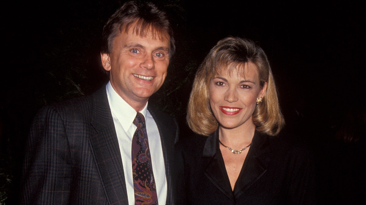 Pat Sajak and Vanna White in black