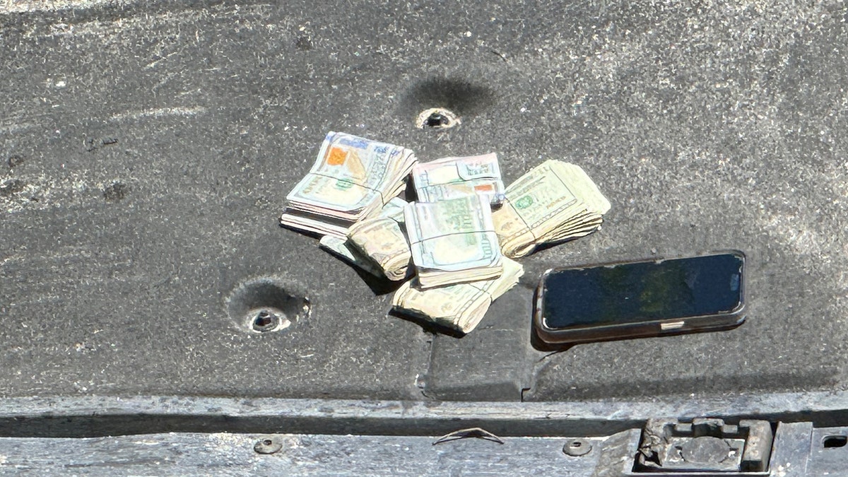 Cash, cell phone left behind on Porsche
