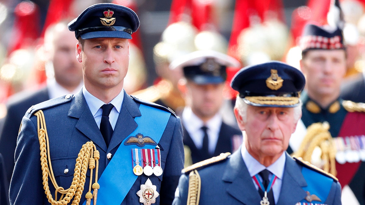 Prince William standing behind his father, King Charles III, at Queen Elizabeth's funeral, in September 2022.