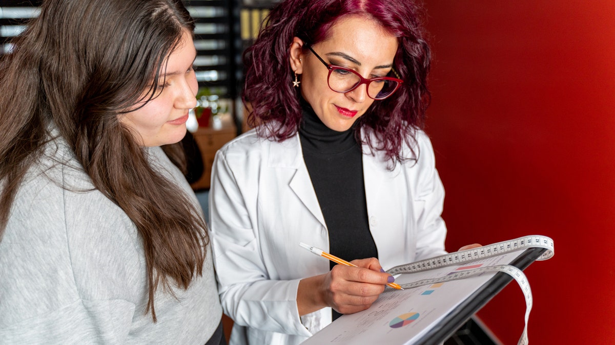 Teen with doctor