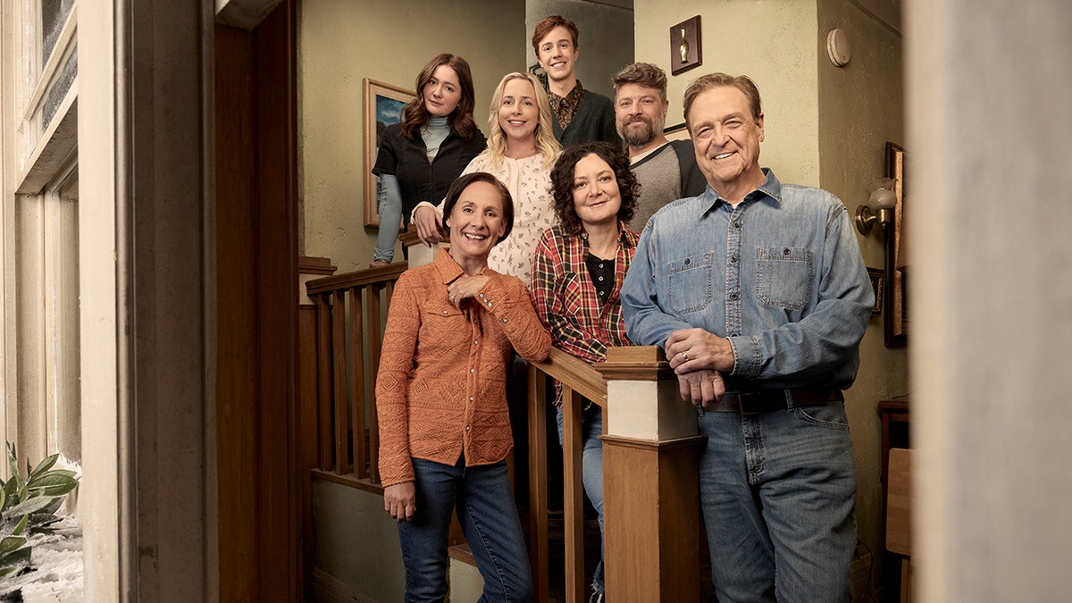 John Goodman poses with The Conners family.