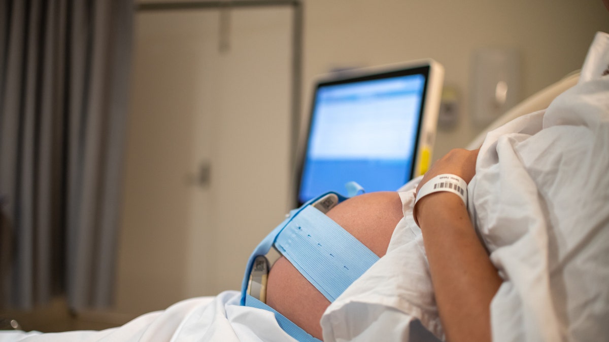 Pregnant woman on monitor