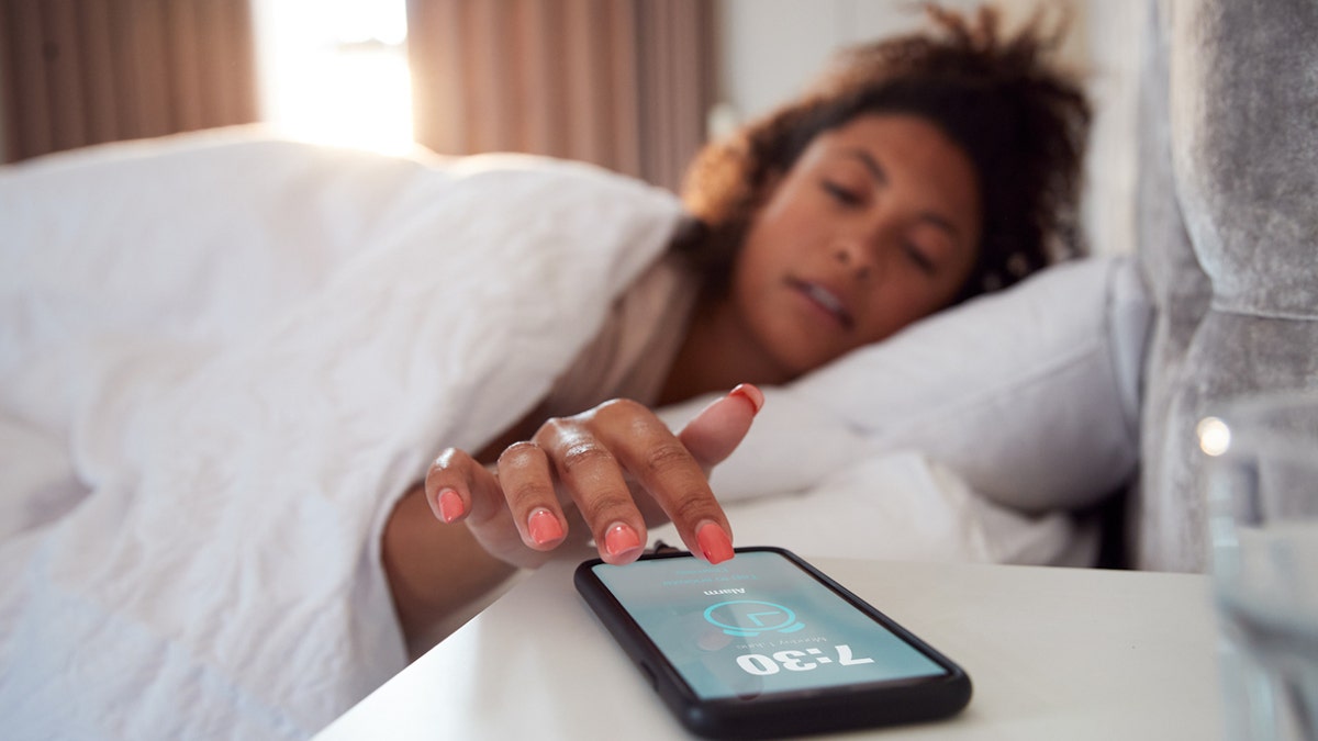 Woman smartphone alarm